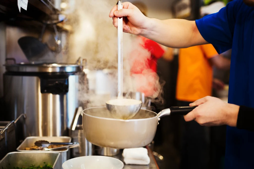 a ramen noodle shop kitchen a chef preparing bowl 2026 03 25 01 30 51 utc