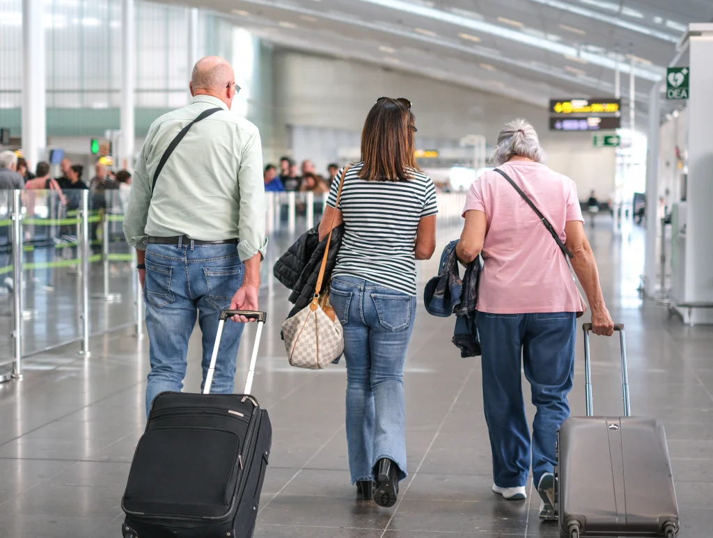 back view of three elderly tourists inside the air 2026 03 27 01 41 29 utc