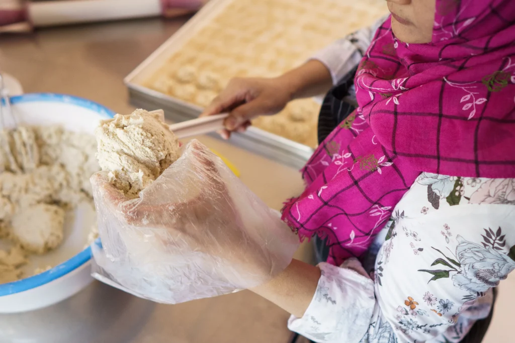 woman muslim working on her flour dough to make so 2026 03 26 06 53 22 utc